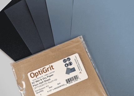 Packaged OptiGrit sandpaper with assorted colors on a gray background