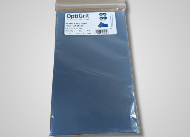 Packaged OptiGrit wet and dry paper on a gray background