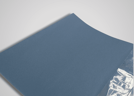 Blue optigrit paper with a clear plastic sheet on a gray background