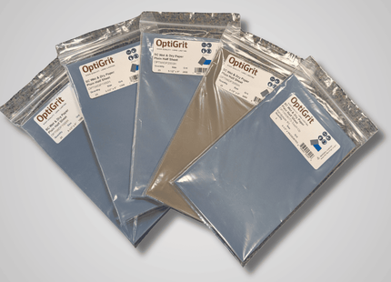 five packages of OptiGrit on a gray background
